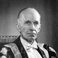Chancellor Charles Vincent Massey sitting for a black and white portrait in his ceremonial robes and white tie attire.