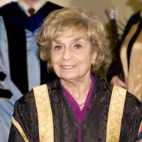 Chancellor Rose Wolfe at Convocation in her ceremonial black and gold robes.